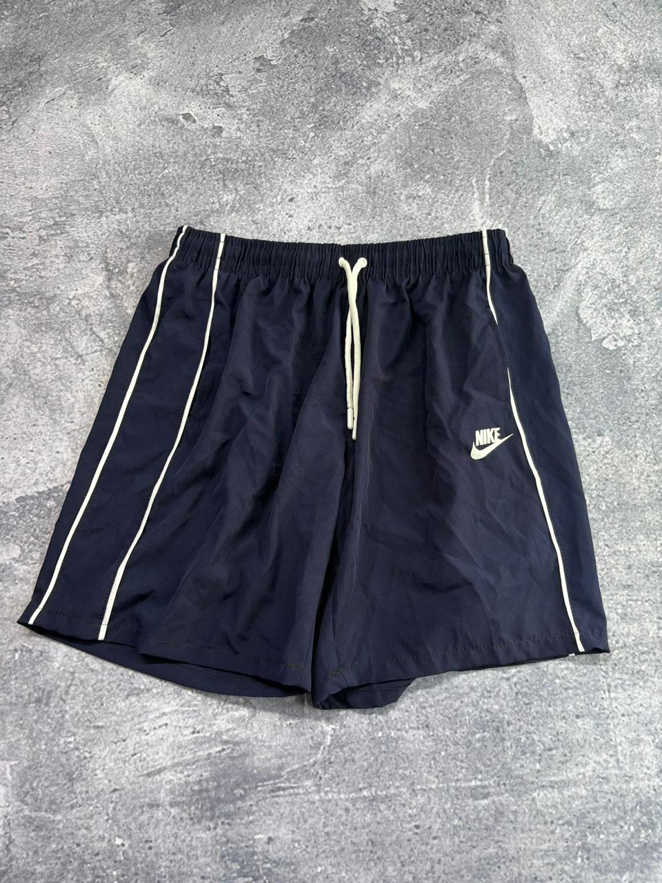 SHORT ELASTANO NIKE PREMIUM AZUL NIKE simbolo no meio